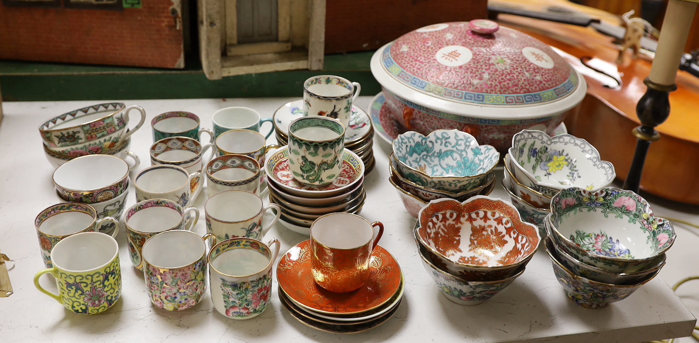 A group of Chinese enamelled porcelain coffee cups and saucers, and similar petal lobed bowls, mid 20th century